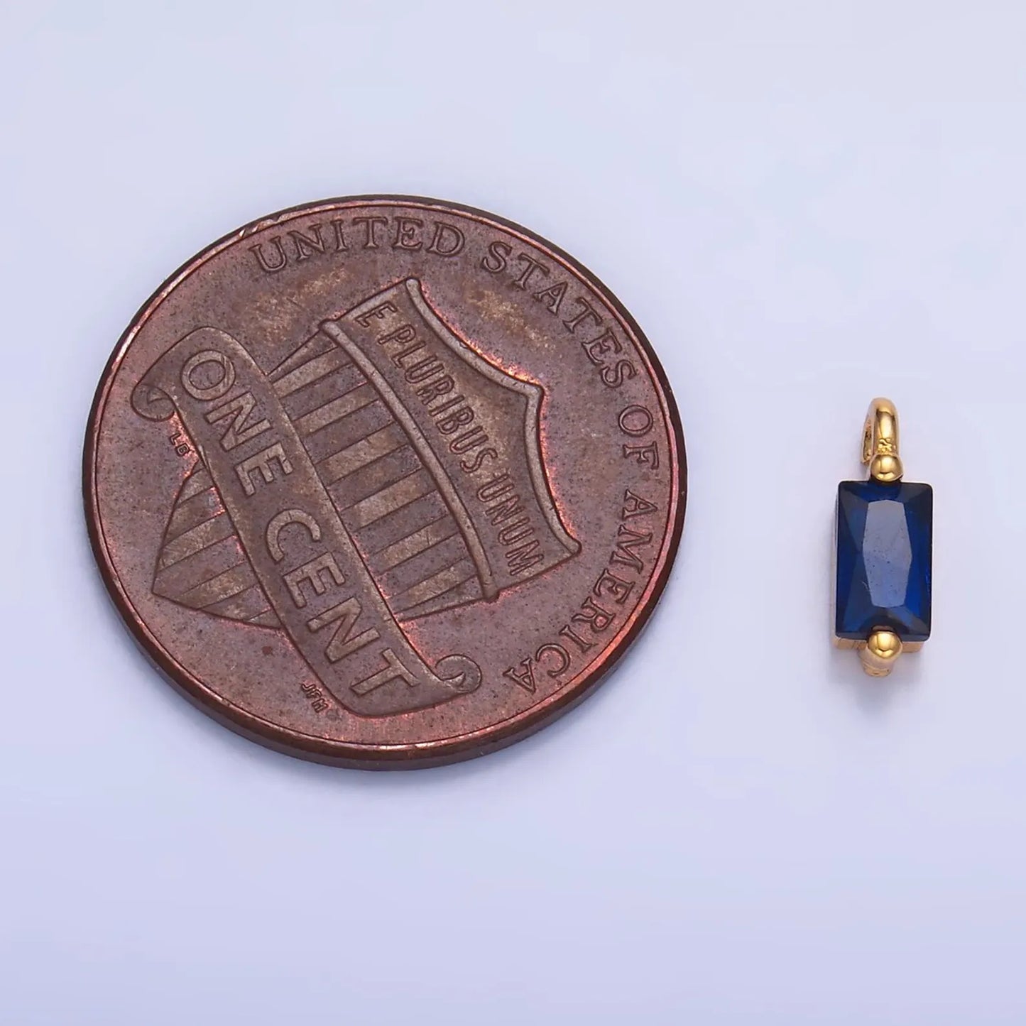 Gold Blue Emerald Cut Charm